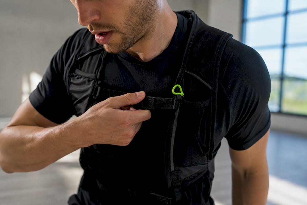 Runner checking hydration vest fit