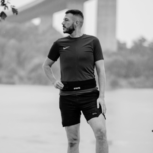 STRYQ running belt beside a running vest and soft flask