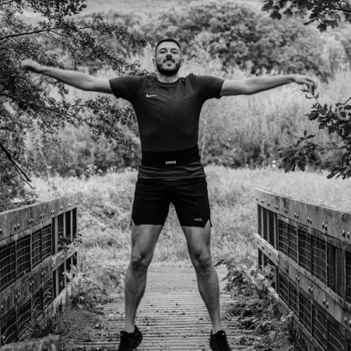 Runner wearing a STRYQ running belt outdoors