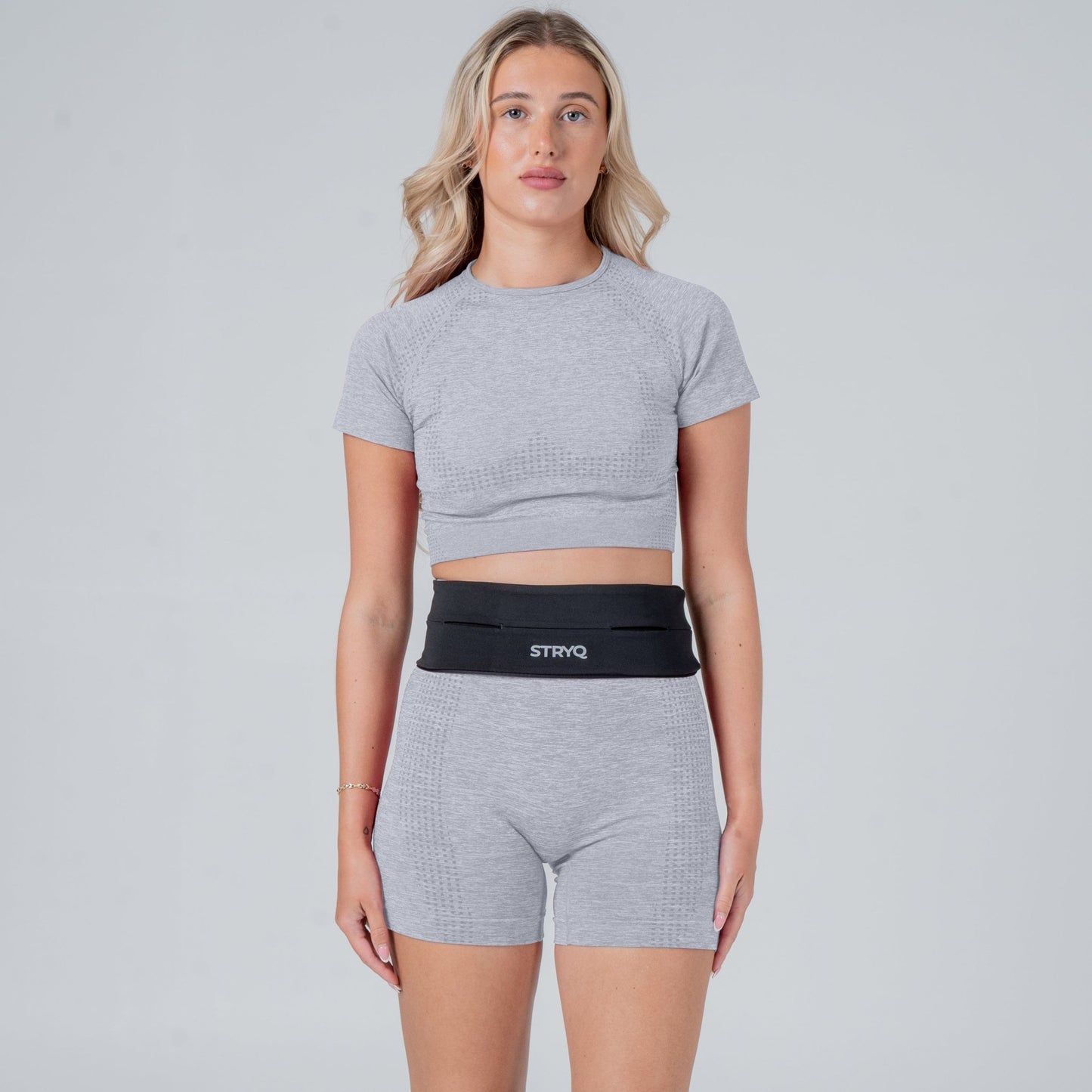Runner wearing a black running belt in photoshoot