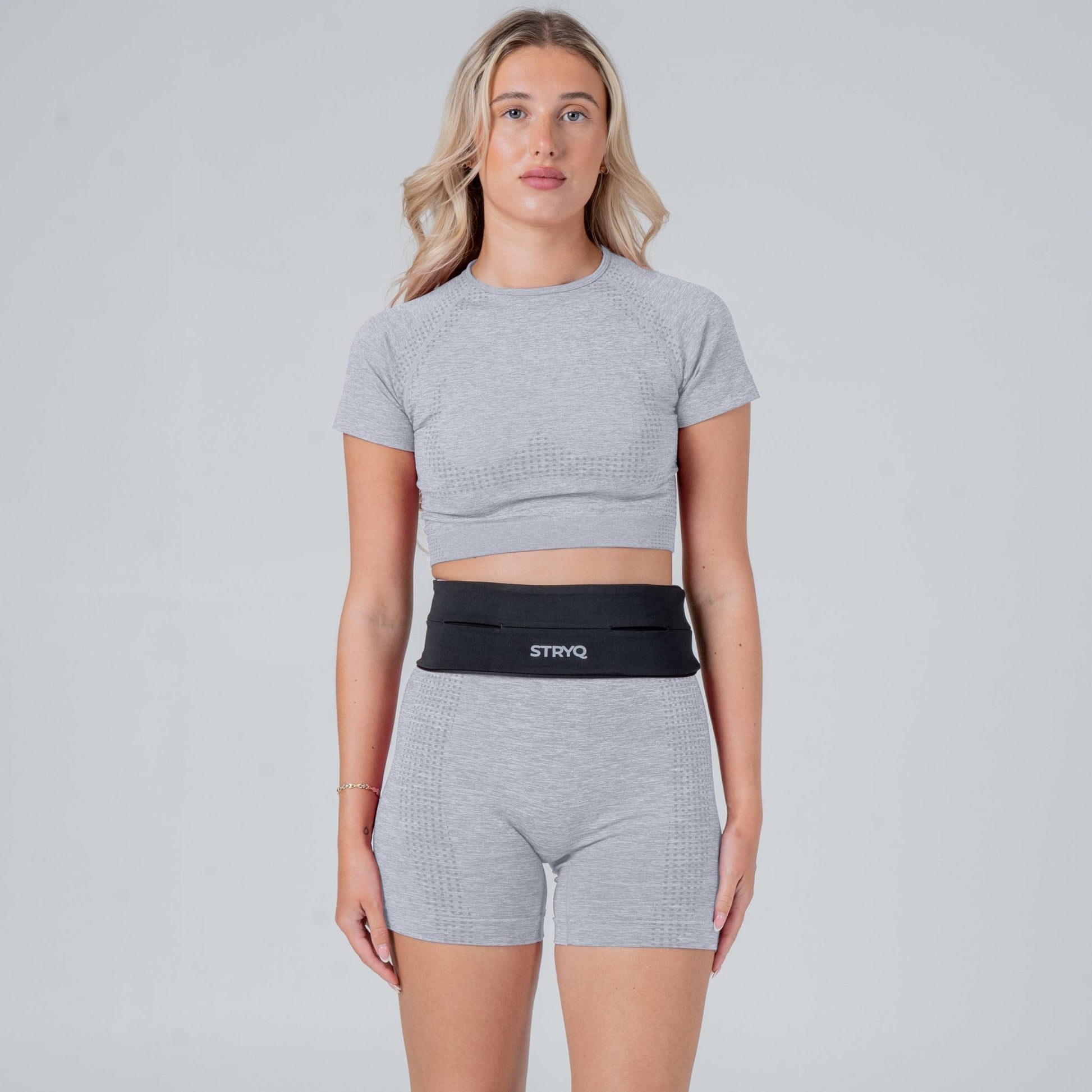 Runner wearing a black running belt in photoshoot