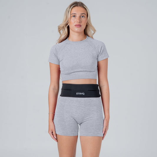 Runner wearing a black running belt in photoshoot