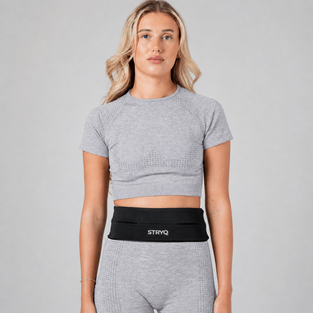 Black STRYQ running belt with 360 degree storage for phone and keys
