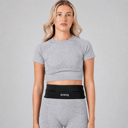 Black STRYQ running belt with 360 degree storage for phone and keys